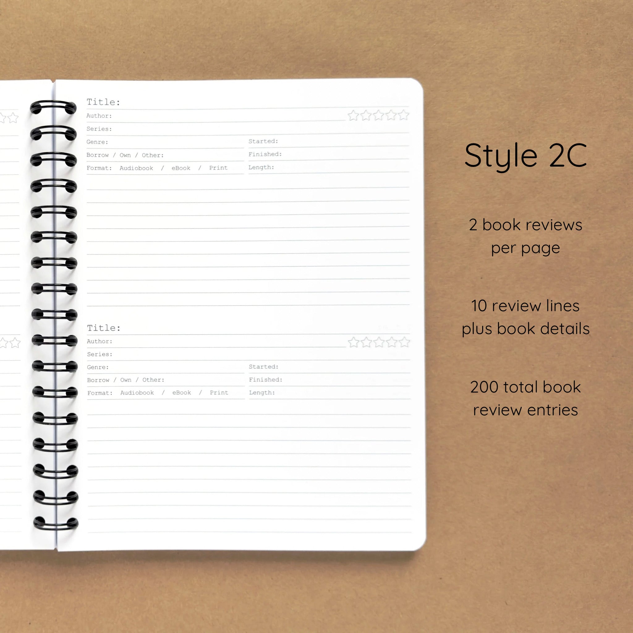 Open spiral-bound softcover reading journal notebook showing review template option Style 2C featuring two book reviews per page and ten review lines plus book details per review, displayed on a brown background