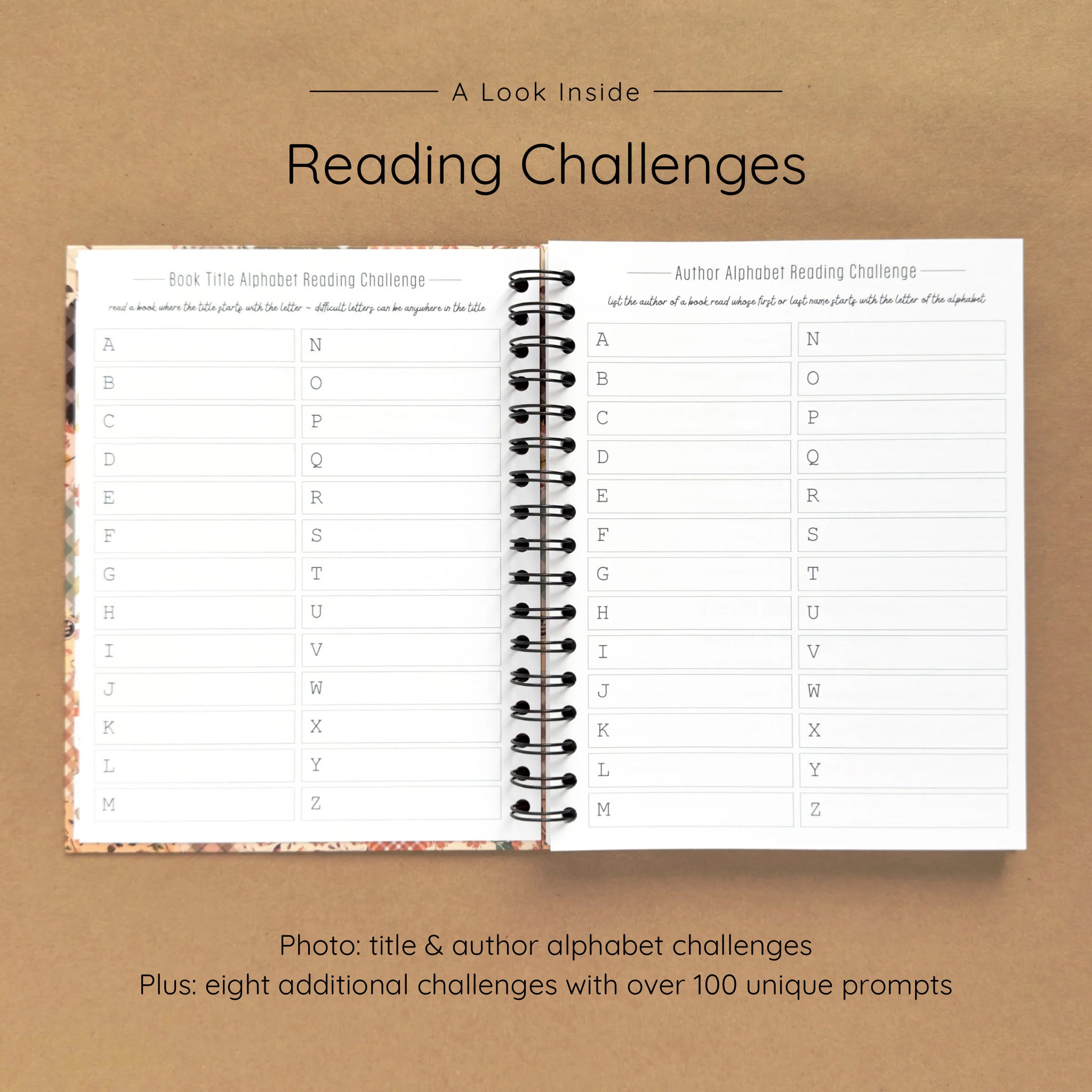 Open spiral-bound hardcover reading journal notebook showing alphabet reading challenges on a brown background