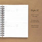 Open spiral-bound hardcover reading journal notebook showing review template option Style 2C featuring two book reviews per page and ten review lines plus book details per review, displayed on a brown background
