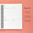 Open spiral-bound softcover reading journal notebook showing review template option Style 2C featuring two book reviews per page and ten review lines plus book details per review, displayed on a peach background