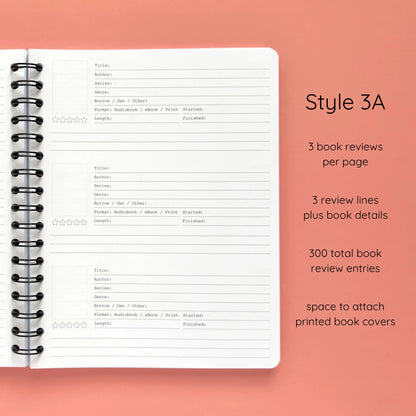 Open spiral-bound softcover reading journal notebook showing review template option Style 3A featuring three book reviews per page and three review lines plus book details per review with space to attach printed book covers, displayed on a peach background
