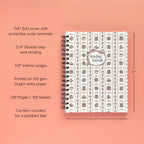 Spiral-bound softcover reading journal notebook with books and bows coquette cover design on a peach background, featuring details and dimensions