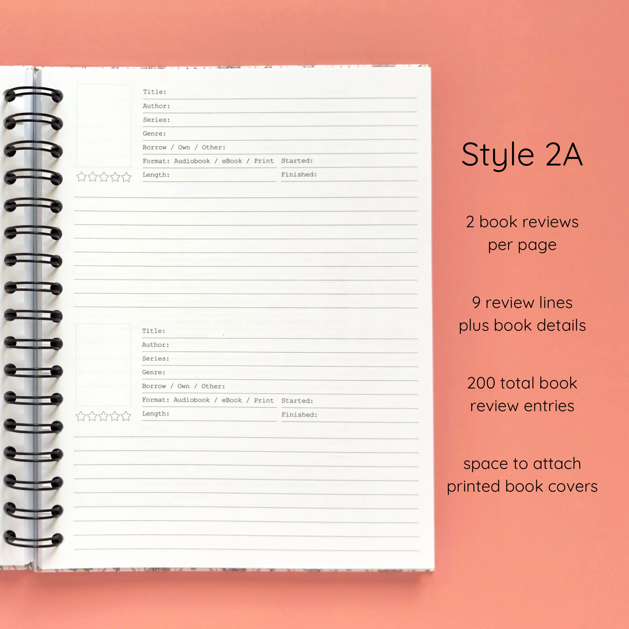 Open spiral-bound hardcover reading journal notebook showing review template option Style 2A featuring two book reviews per page and nine review lines plus book details per review with space to attach printed book covers, displayed on a peach background