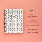 Spiral-bound softcover reading journal notebook with books and bows coquette cover design and variant option details on a peach background