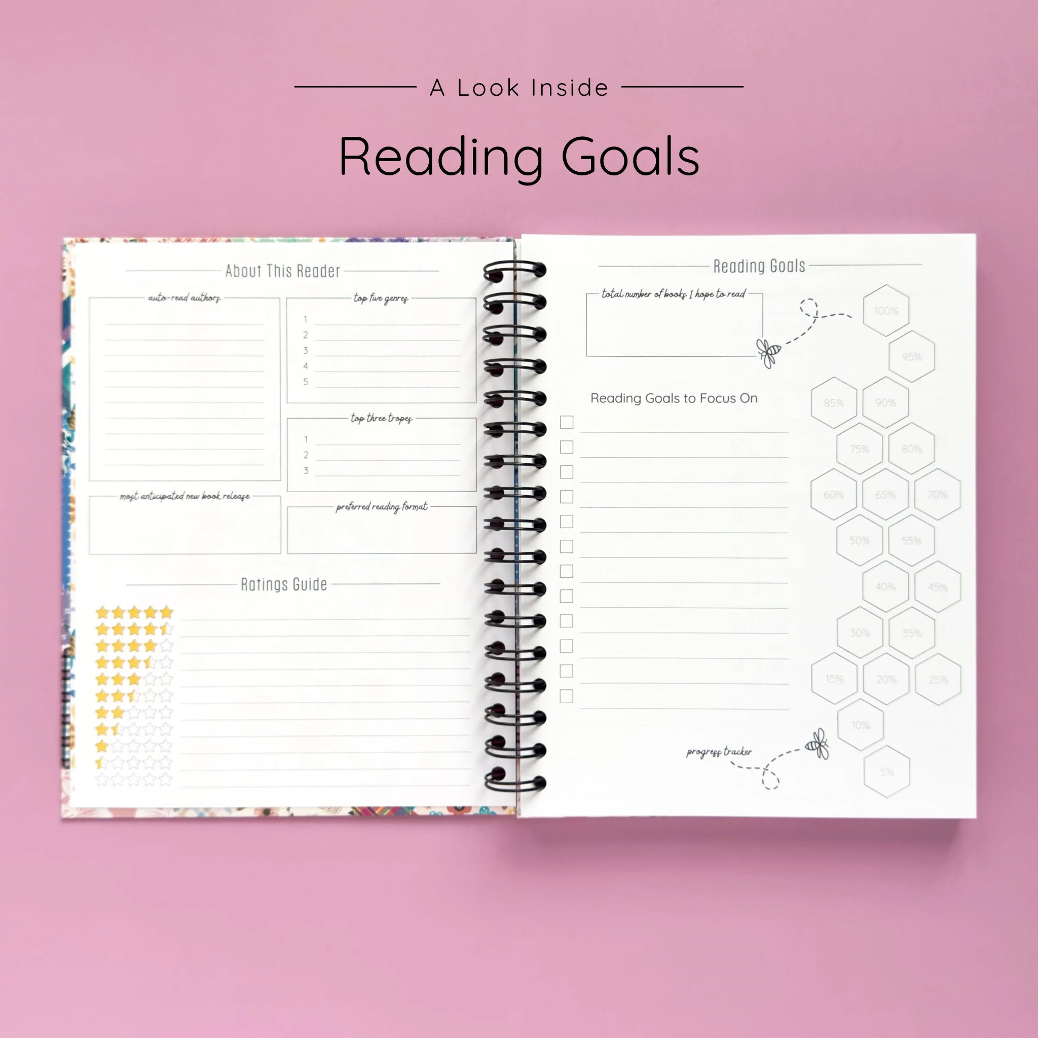 Open spiral-bound hardcover reading journal notebook showing reading goals and ratings guide on a lavender background