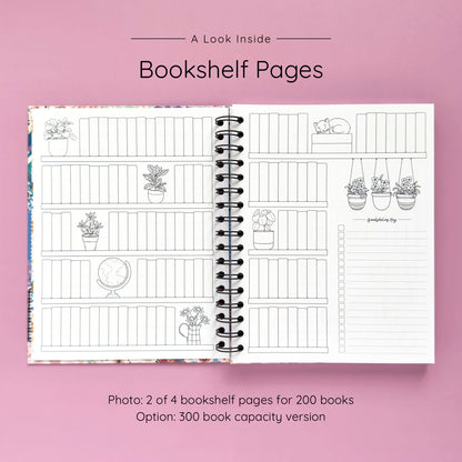 Open spiral-bound hardcover reading journal notebook showing bookshelf pages design on a lavender background