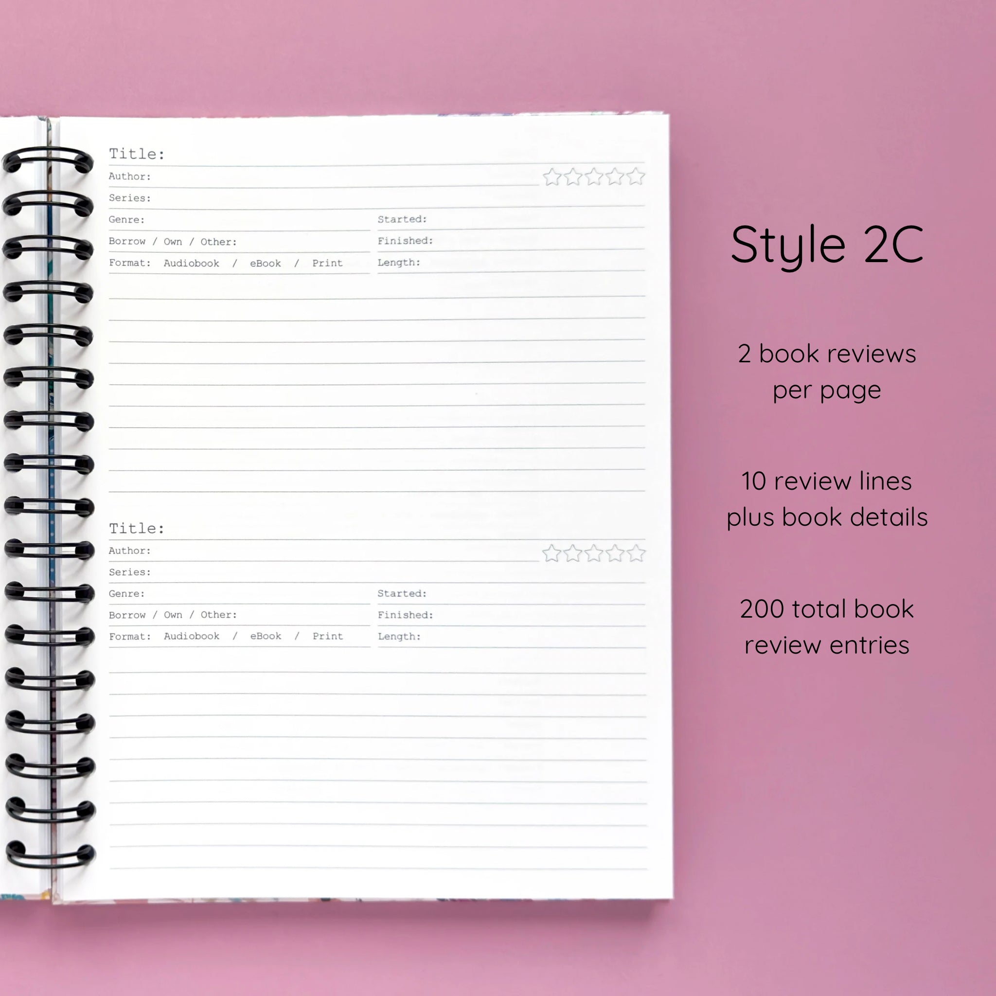 Open spiral-bound hardcover reading journal notebook showing review template option Style 2C featuring two book reviews per page and ten review lines plus book details per review, displayed on a lavender background