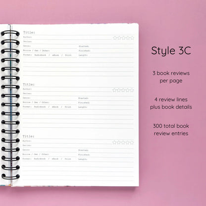 Open spiral-bound hardcover reading journal notebook showing review template option Style 3C featuring three book reviews per page and four review lines plus book details per review, displayed on a lavender background