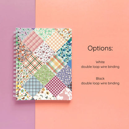 Spiral-bound softcover lined notebook with floral patchwork cover design and binding color option details on a lavender and peach background