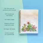 Spiral-bound softcover lined notebook with cactus and succulent cover design on a teal and blue background, featuring details and dimensions