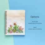 Spiral-bound softcover lined notebook with cactus and succulent cover design and binding color option details on a teal and blue background