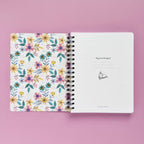 Spiral-bound softcover reading journal flip through video with floral patchwork cover design on lavender background