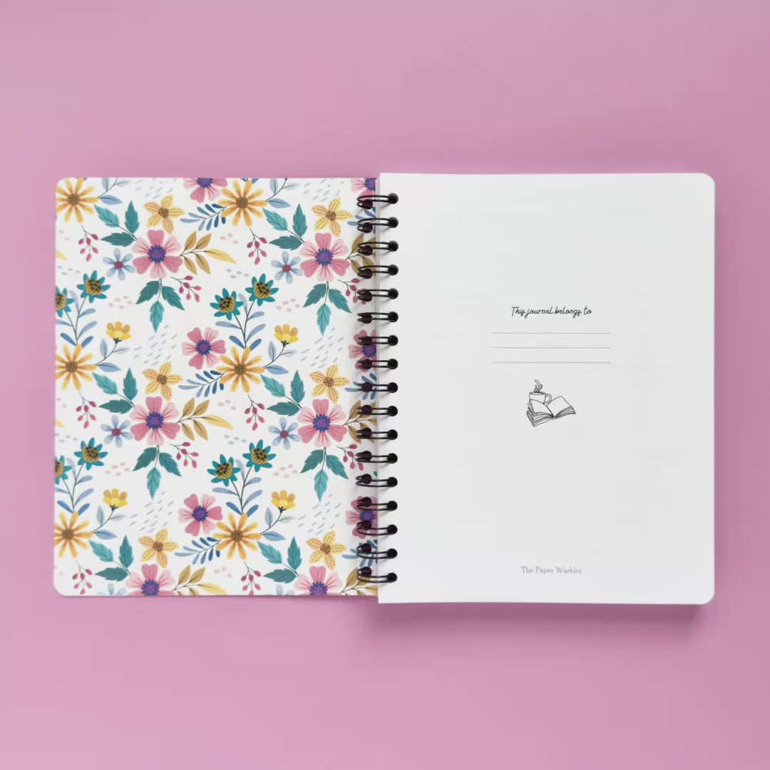 Spiral-bound softcover reading journal flip through video with floral patchwork cover design on lavender background