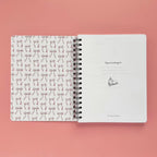 Spiral-bound softcover reading journal flip through video with books and bows coquette cover design on peach background